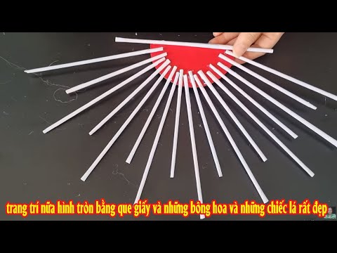 trang trí nữa hình tròn bằng que giấy và những bông hoa và những chiếc lá rất đẹp